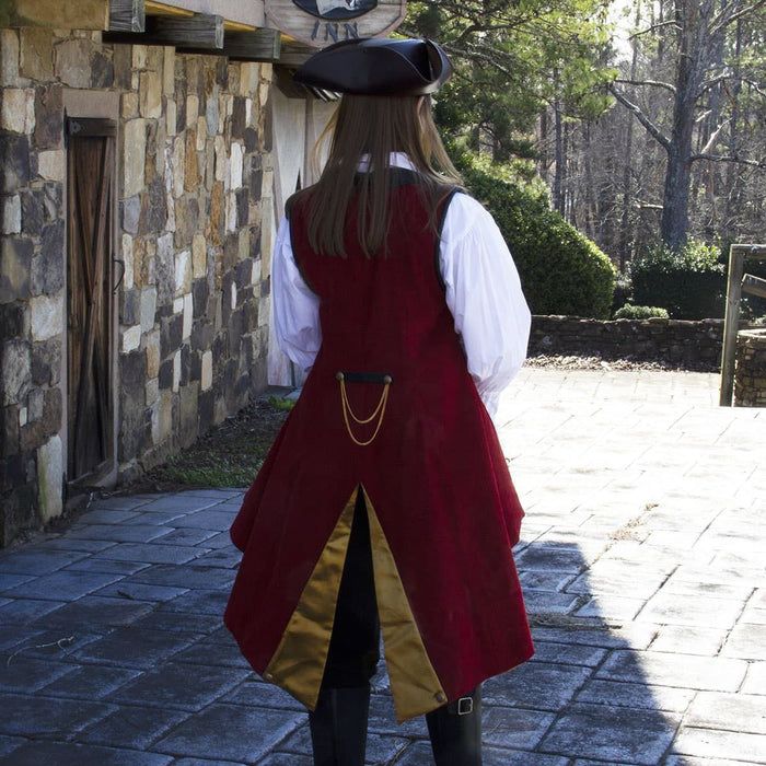red corduroy sleeveless coat with pleated duck-tail, faux black leather collar and shoulder accents, gold buttons and trim