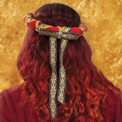 back of red soft cotton velvet padded head rolls detailing rear bow with flowing ribbons